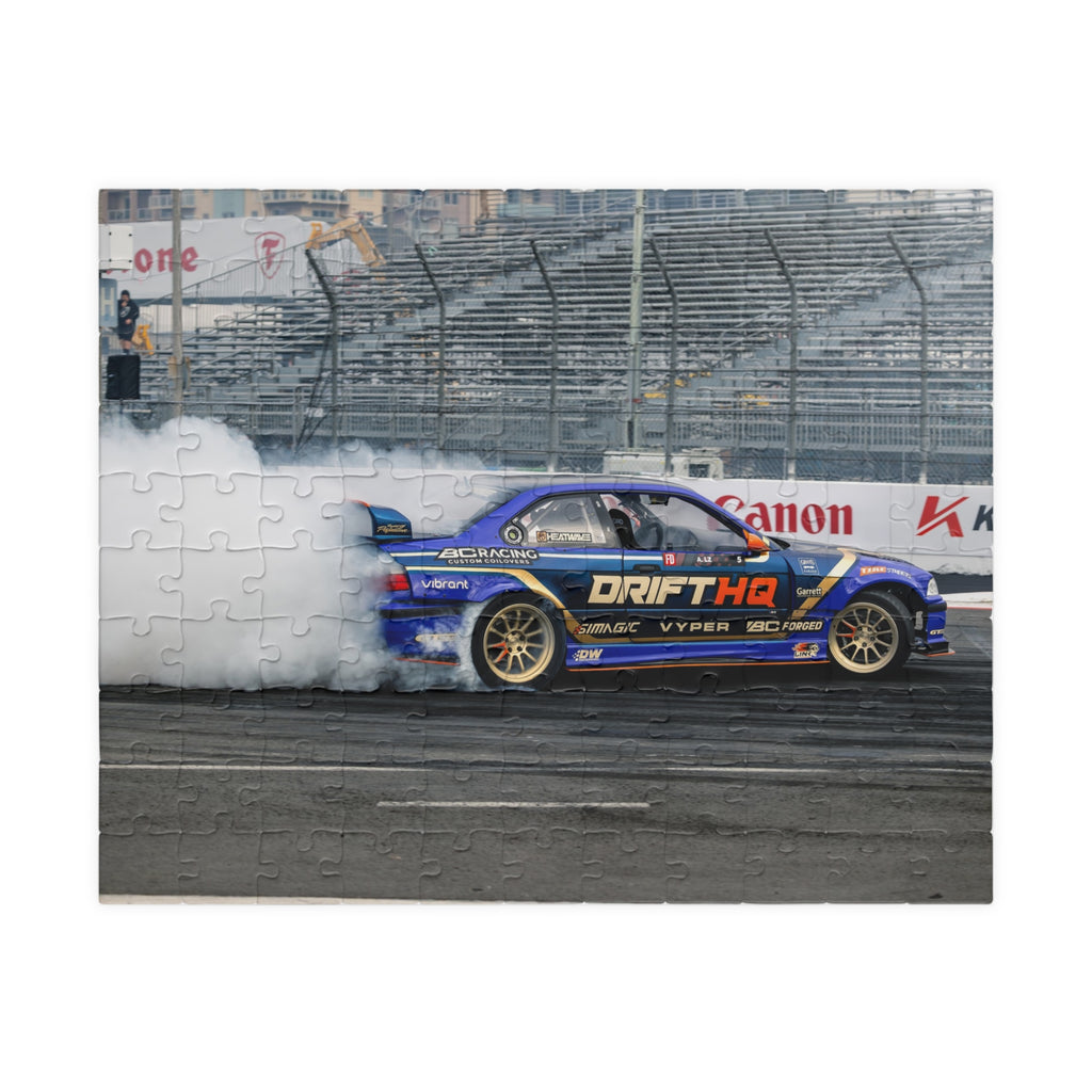Adam LZ drift car jigsaw puzzle featuring a blue drift car and smoky racetrack scene