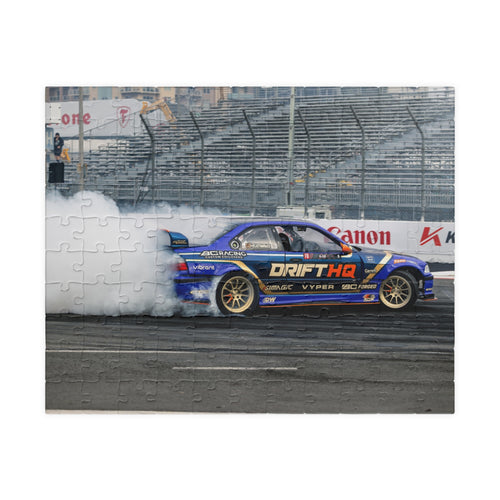 Adam LZ drift car jigsaw puzzle featuring a blue drift car and smoky racetrack scene