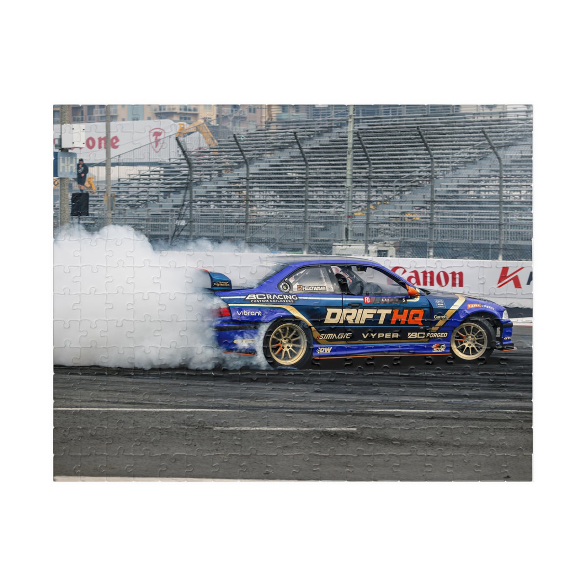 Adam LZ drift car jigsaw puzzle featuring a blue drift car and smoky racetrack scene