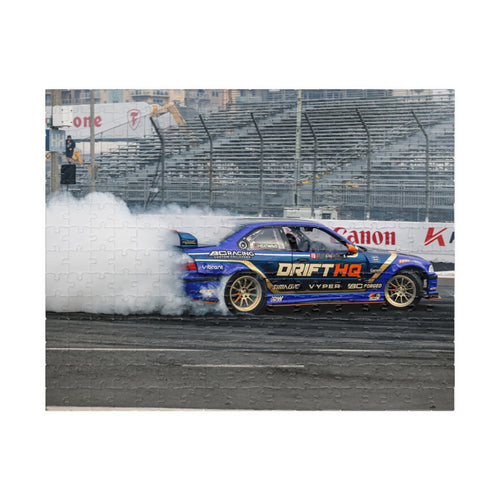 Adam LZ drift car jigsaw puzzle featuring a blue drift car and smoky racetrack scene