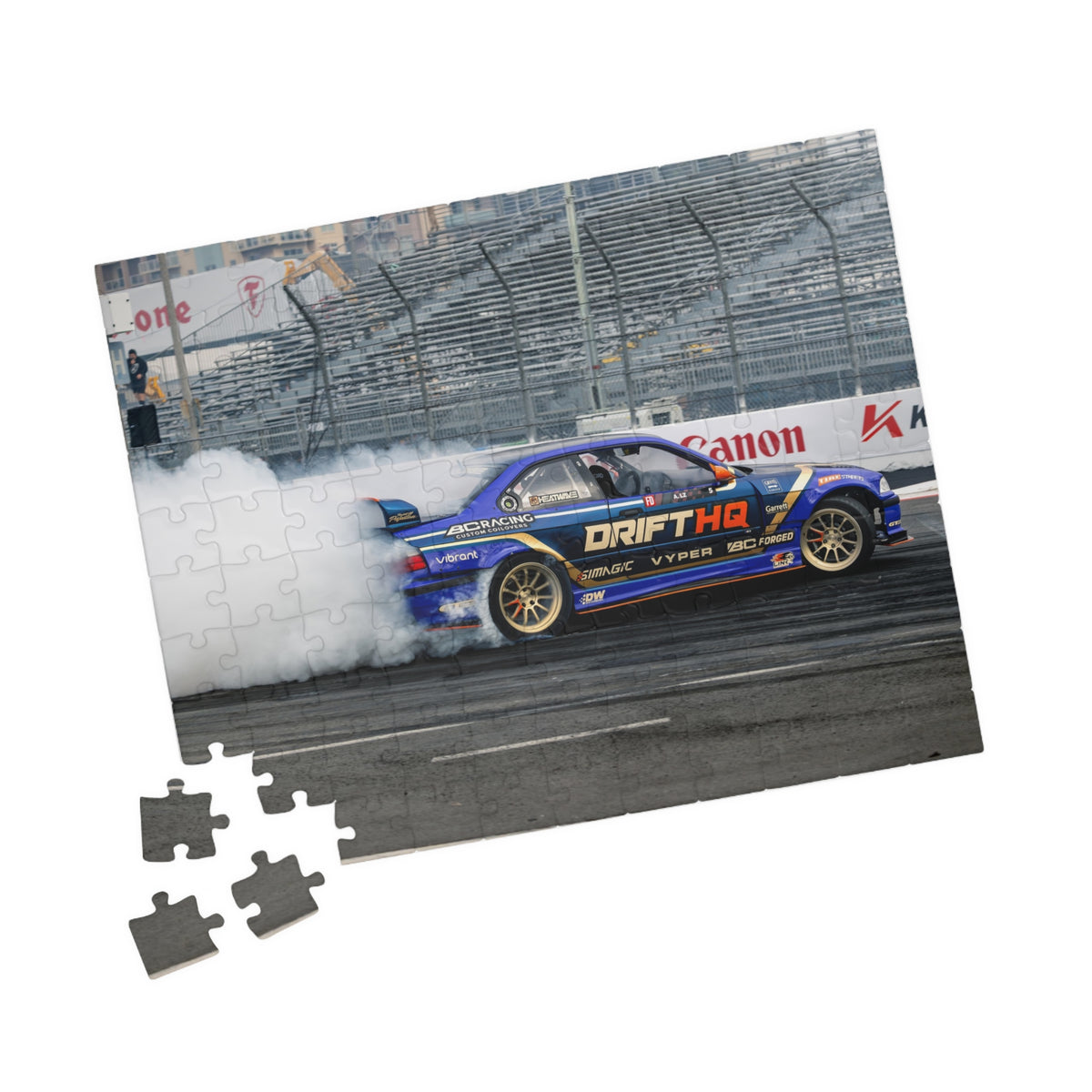 Adam LZ drift car jigsaw puzzle featuring a blue drift car and smoky racetrack scene